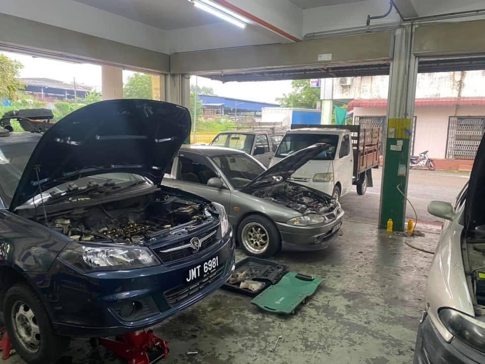 Workshop Interior - Multiple Cars Being Serviced